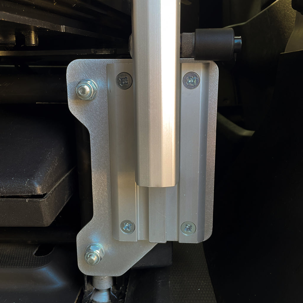 Close-up of Stoutlander ProMaster seat base Lagun mount showing CNC aluminum bracket and Lagun post clamp detail